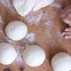 Baker hands kneading dough in flour on the table - VideoHive Item for Sale