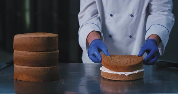 A Close Up of a Large Baker in Chefs Attire