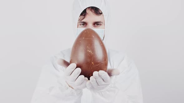Coronavirus doctor with chocolate easter egg