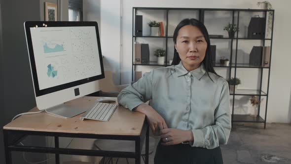 Woman Posing by Computer