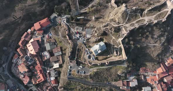 Aerial view of Metekhi church in old Tbilisi located on cliff near river Kura. Georgia 2022 winter