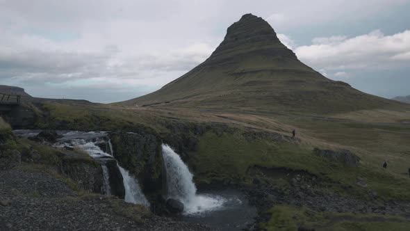 Static shot of a waterfall with the mountain Kirkjufell in Iceland