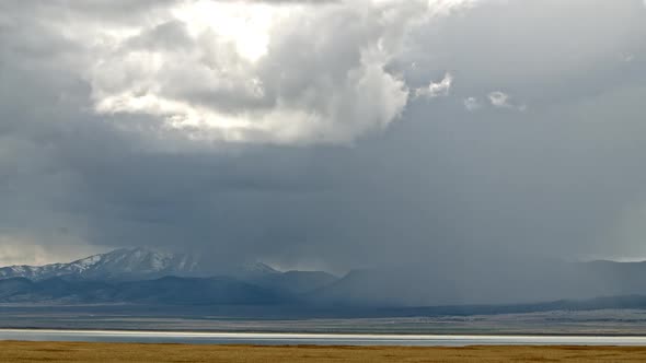 Storm rolling over mountains through the landscape