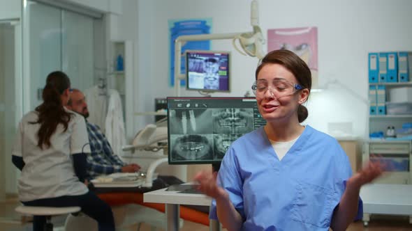 Dentist Nurse Talking with Remote Patients About Oral Hygiene