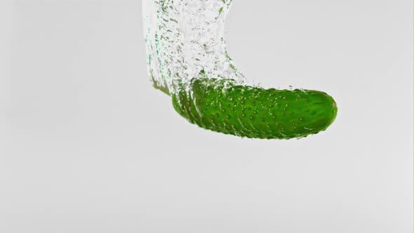 Super Slow Motion One Cucumber Falls Under the Water