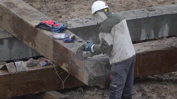 Angular Saw Grinding Through Construction Piles at Construction Site