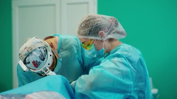 Doctors during surgery. Team operating patient in operation theater