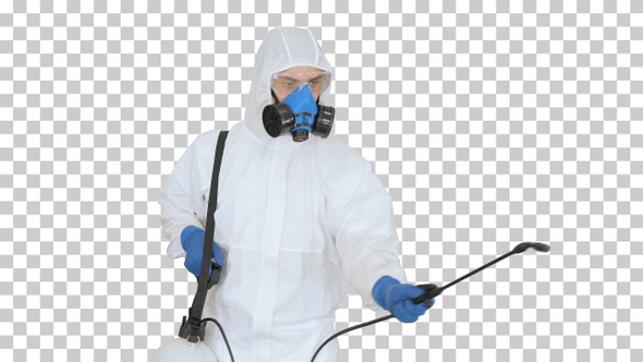 Man in a hazmat walking in and using disinfectant, Alpha Channel