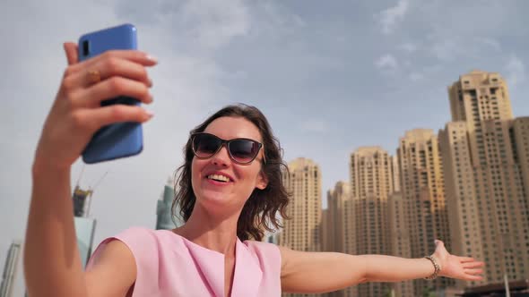 The Girl is Broadcasting Live Using a Phone From Dubai