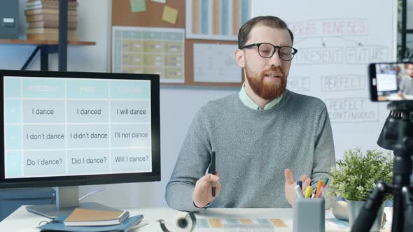 Online Tutor Recording Video Lesson Using Smartphone Camera in Classroom alt
