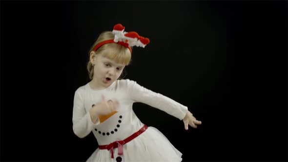 Happy Beautiful Little Baby Girl in Snowman Costume. Make Faces, Dance