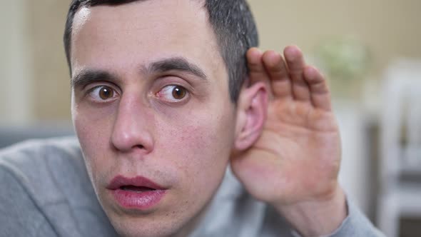 Man Wants to Hear Better with the Palm of His Hand
