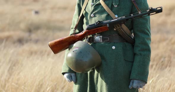 World War II German Soldier Holding Soviet Russian Submachine Gun