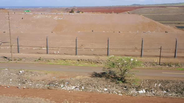 Light Trash Flew From Garbage Facility Plant To Countryside Field Across Road