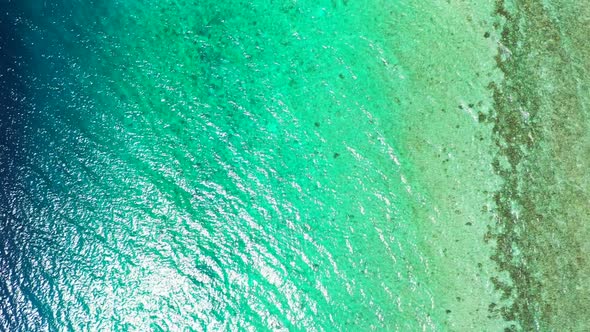 Aerial view nature of idyllic resort beach trip by clear ocean and white sandy background of adventu