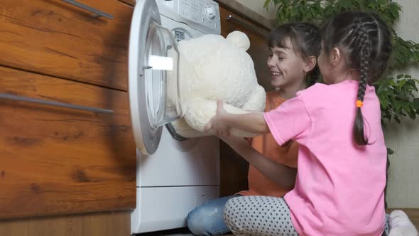 Children at the washing machine.