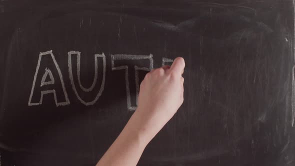 The Term Autism Is Written in Chalk on a Blackboard Timelapse