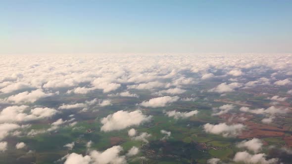 Aerial view of countryside and cloudscape from window seat
