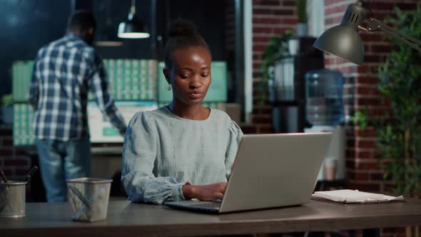 Female Broker Analyzing Stock Market Exchange on Laptop