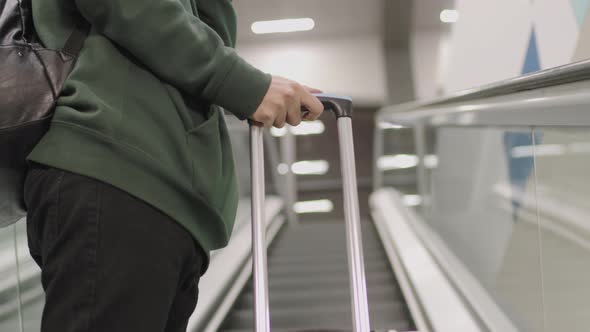 Man In Headphones On Escalator