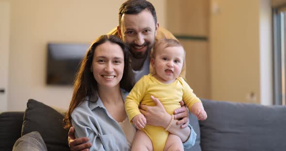 Video Portrait of a Happy Caucasian Family with a Baby
