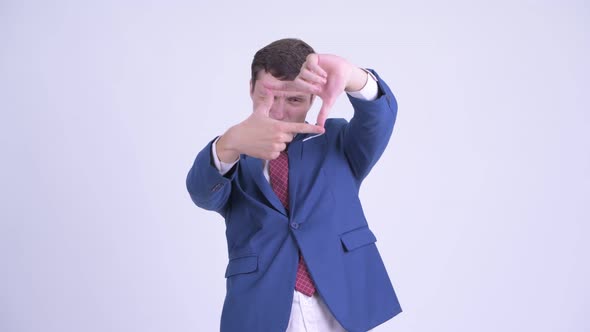 Young Handsome Businessman Focusing with Fingers