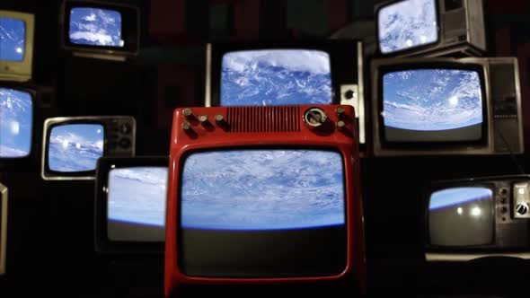 Earth Planet, Rotating on its Axis in Space, Seen on Retro TVs.