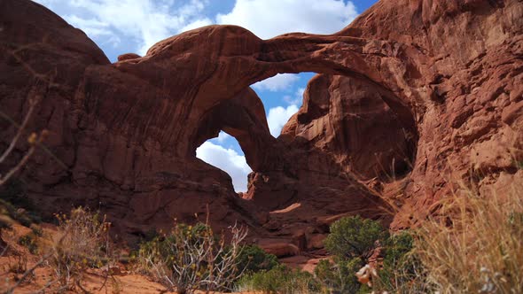 Time lapse of clouds moving while viewing Double Arch