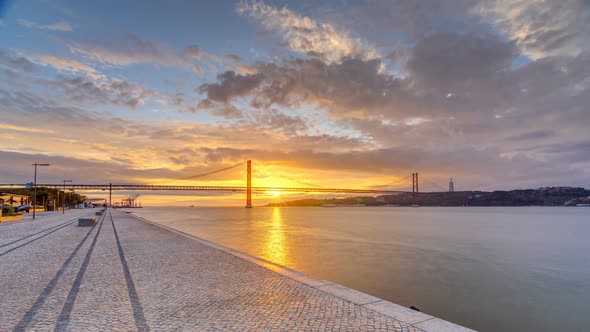 Lisbon City Sunrise with April 25 Bridge Night To Day Timelapse