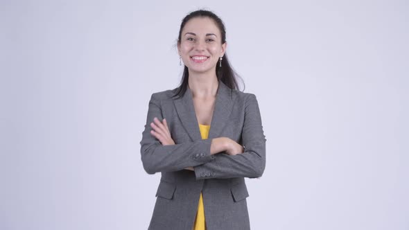 Happy Young Beautiful Businesswoman with Arms Crossed