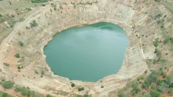 Open Copper Pit Mine Filled with Blue Water in Bulgaria, View From Above