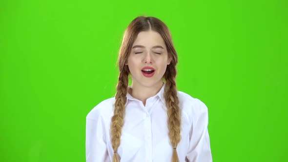 Schoolgirl Yawns . Green Screen