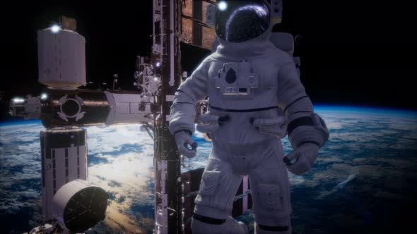 International Space Station and Astronaut in Outer Space Over the Planet Earth