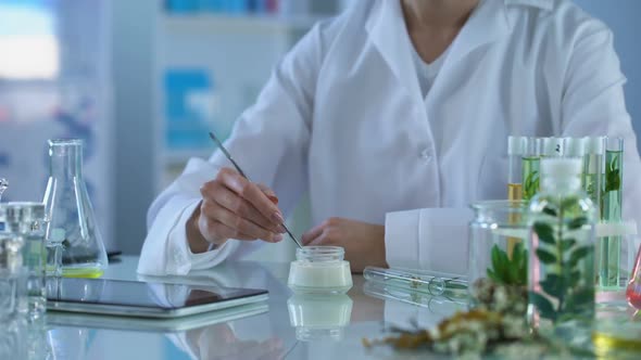 Cosmetology Expert Testing New Cream, Applying on Hand and Making Tablet Report