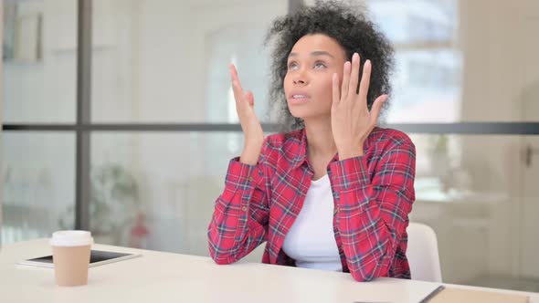 Upset African Woman Feeling Worried While Sitting