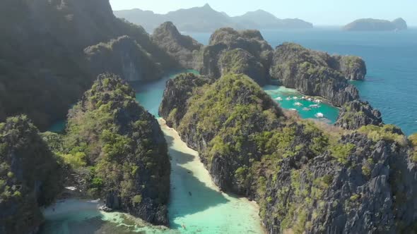 Aerial view of Big Lagoon with outrigger boats, El Nido