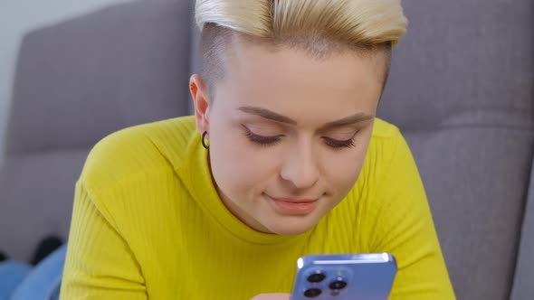 Tomboy person using mobile app on modern smartphone in 4k stock video