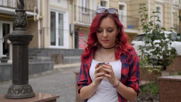 Red Hair Girl Holding a Paper Cup