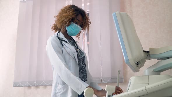 Close-up of Face of Professional African American Obstetrician Gynecologist in Protective Mask