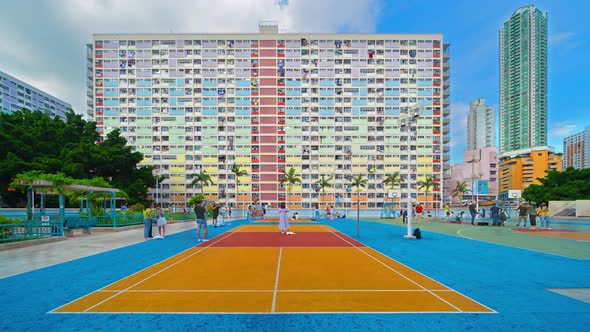 Time lapse of colorful rainbow pastel building with basketball court and facade windows background