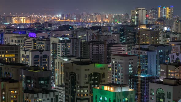 Aerial Skyline of Abu Dhabi City Centre From Above Night Timelapse