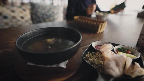 A Man in a Restaurant Ordered Asian Pho Bo Soup