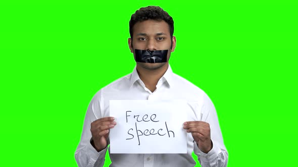 Indian Man with Taped Mouth on Green Screen