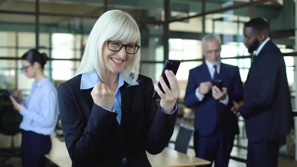 Excited Business Woman Smartphone Showing Success Gesture, Stock Trading App