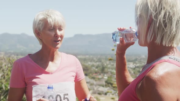 Athletics women drinking water