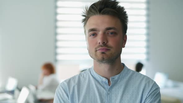 Close-up Portrait of Confident Happy Office Worker Looking at Camera in Modern Office, Positive Male