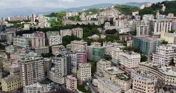 Urban Hillside Buildings in Popular Italy City of Genova - Aerial Panning