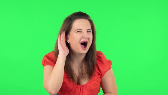 Portrait of Girl Holding Hand Near Ear Trying Listen To Interesting News Expressing Communication