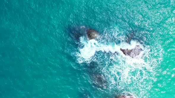 Aerial drone view panorama of tropical island beach vacation by blue green sea with white sandy back