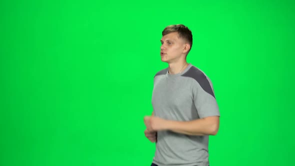 Young Male Goes Then Starts To Run, Waves His Hand Stand, Chroma Key